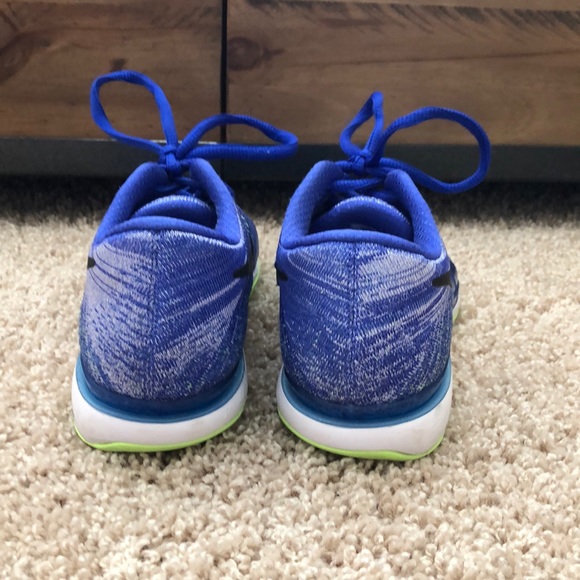 Nike Zoom Vapor Flyknit tennis shoes.